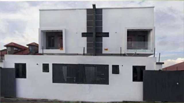 Residential apartment building at Osapa London, Lekki, Lagos, white facade with dark feature panel